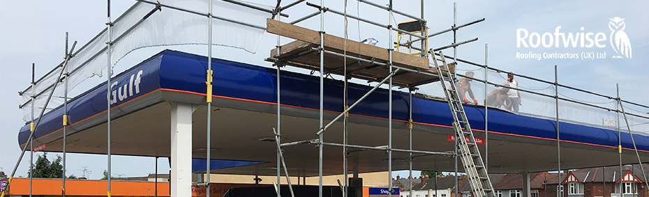 Petrol station roof repair with scaffolding